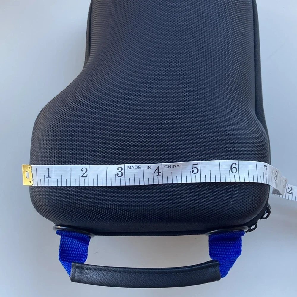 Hard carrying case for long-lens camera with strap